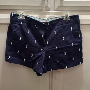 Navy blue shorts with seahorses on them. Size 8